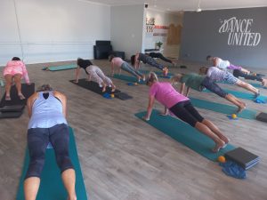 Planking exercises work the body as a whole and helps with stabilization of the shoulders and pelvis.  Modified versions are always available in my classes.